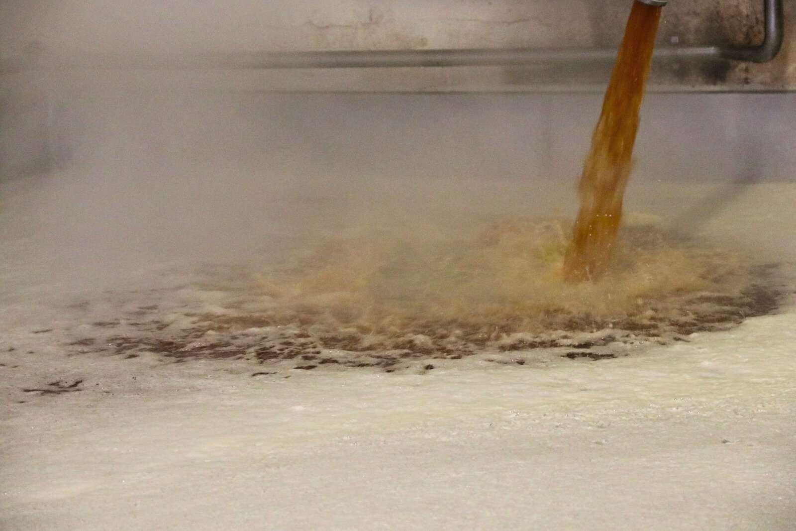 Lambic beer pumped into the coolship