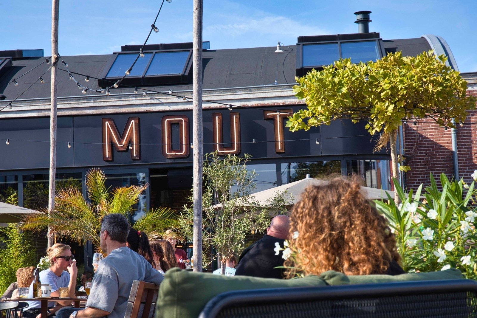 Outdoor terrace at Gooische Brewery and Foodhall Mout in Hilversum