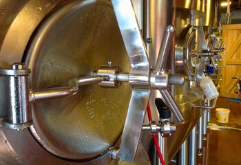 Stainless steel fermentation tanks at Maallust brewery 