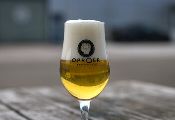 Tasting an Oproer beer during our visit to the production brewery 