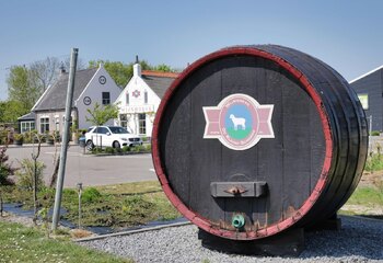 Wine cask outside Dutch winery Wijnhoeve De Kleine Schorre in Zeeland